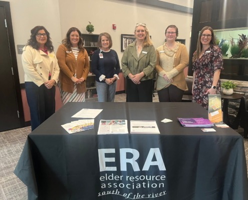 ERA Members at Meeting standing in front of a table
