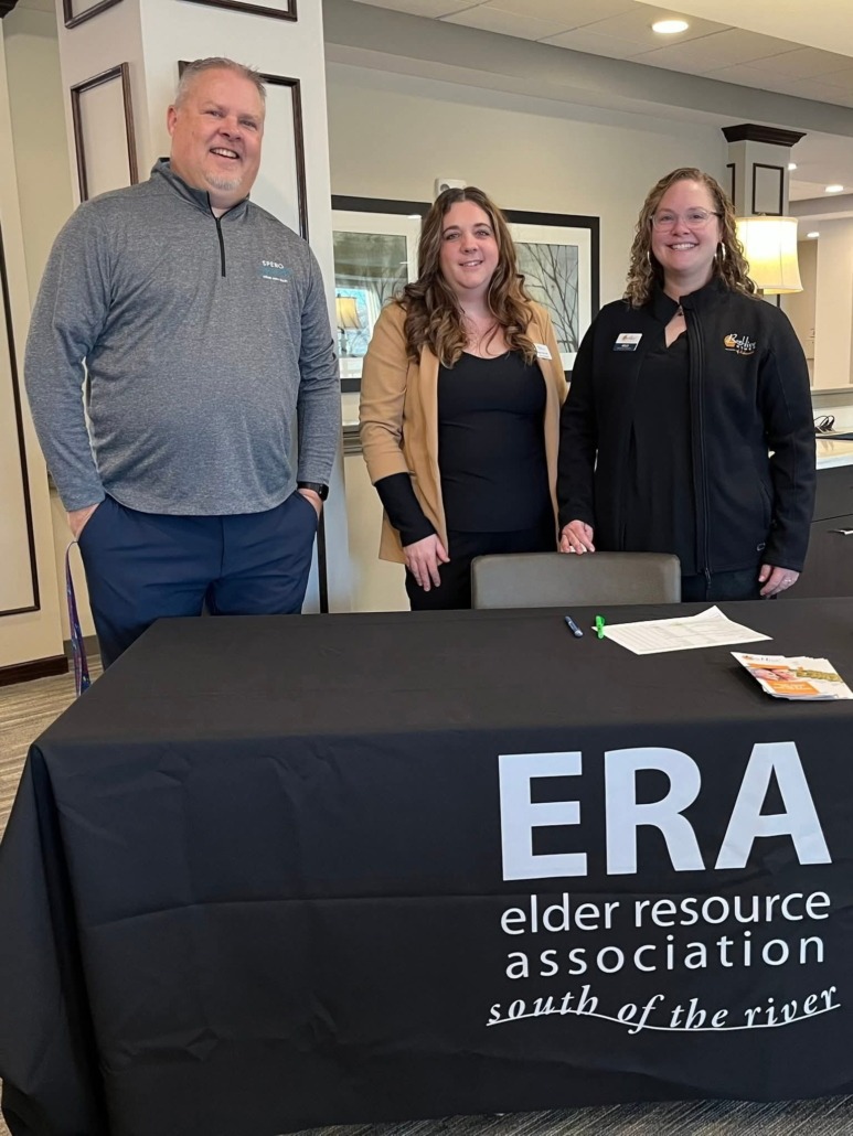 ERA Members at Meeting standing behind a table with a black table cloth